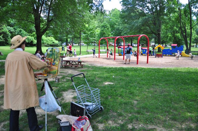 Artist Jill Banks works on a painting near the playground at McLean Central Park. The Fairfax County Park Authority has started the master planning process for McLean Central Park, which will revise the 2000 plan. 