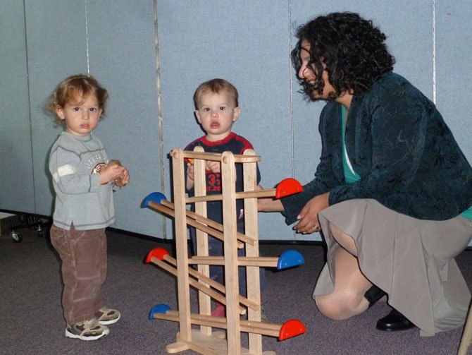 Ayelet “Ellie” Lichtash, executive director and founder of Alef Bet Montessori School, with Shaya Ratner and Meir Herman, 18 months old.