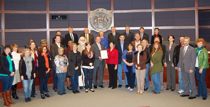 The Board of Supervisors designated Dec. 14, 2012, as Jeans Day in Fairfax County at their Dec. 4 meeting. (Center) Jim Corcoran, president of The Fairfax Chamber of Commerce, holds the proclamation with Board of Supervisors Chairman Sharon Bulova.
