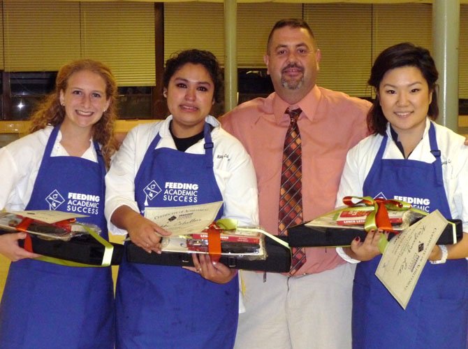 Holding their prizes are (from left) Valerie Claunch, Nikki Caballero, Chef Clay Doubleday and Kyung Lee.