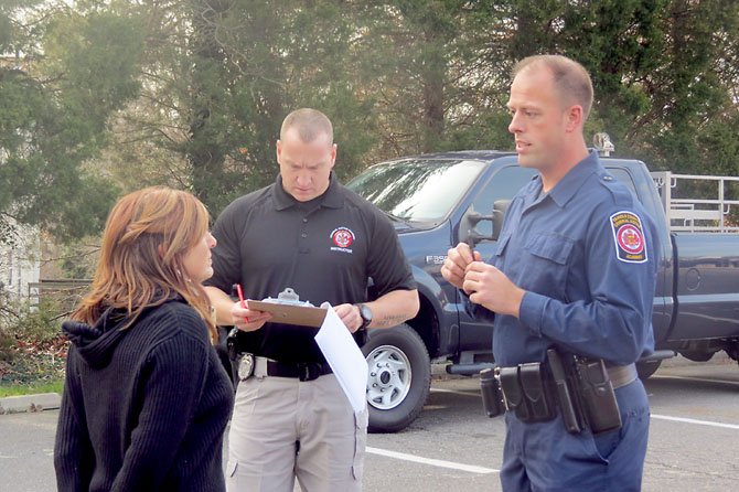 Academy instructors PFC Richard Cash and PFC Liz Barrington demonstrate a mock DWI case as another officer takes notes.