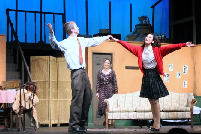 Catherine Ariale and Drew Holcombe dance as Anne and Otto Frank as Rachel Steiner (Mrs. Van Daan) watches.