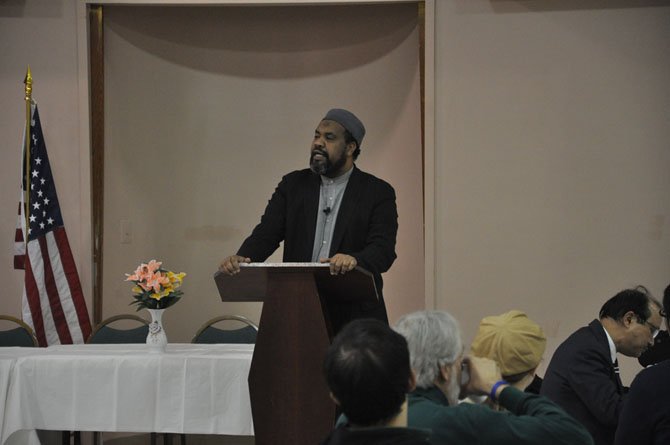 Imam Mohamed Magid, executive director of the All Dulles Area Muslim Society, speaks on the importance of faith in peace Feb. 3, 2011, during the ADAMS commemoration of World Interfaith Harmony Week.