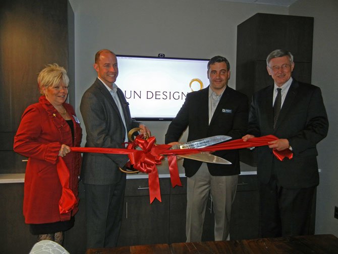 Seen here, cutting a ribbon to open the new office are, from left: Marcia Twomey, president of the Chamber; Craig Durosko, founder and chairman of Sun Design; Bob Gallagher, president of Sun Design; and John Foust, member of the Fairfax Country Board of Supervisors. Sun Design recently was named, for the second year in a row, among the region's best places to work. 