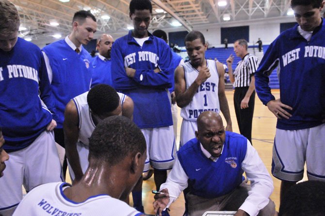 West Potomac boys’ basketball David Houston III talks to the Wolverines during their Dec. 11 victory against T.C. Williams.