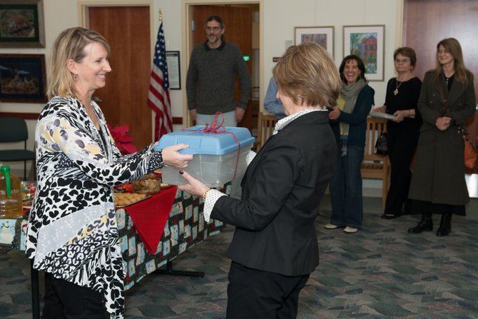 Great Falls Studios donated a professional hook and cable art display system to the Great Falls Library at a reception on Dec. 10. Jennifer Duncan, co-chair of the Great Falls Studios Exhibits Committee, made the presentation to Great Falls Library Branch Manager Daniela Dixon on behalf of the group.