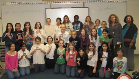 Churchill Road fifth and sixth grade girls in the GEMS club take advantage of the opportunity to have a photograph taken with former shuttle astronaut Dr. Mary Cleave. Dr. Cleave presented each of the girls with a sticker representing the crew patch that she wore on one of her shuttle flights.
