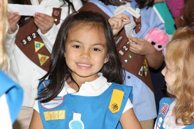 Madison Hays, a Daisy Scout, attends the Investiture/Rededication Ceremony.
