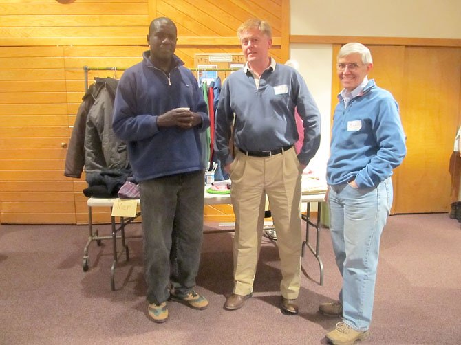 Musa, Braddock Supervisor John Cook, and Bill Murray at the check-in area for the hypothermia prevention shelter provided by Burke United Methodist Church on Friday, Dec. 21.

 
