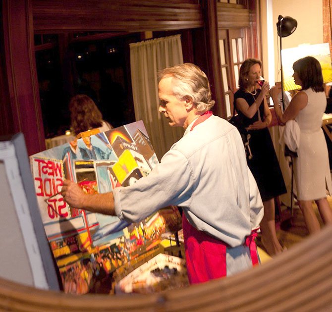 Bob Gilbert in a mirror at an art auction.
