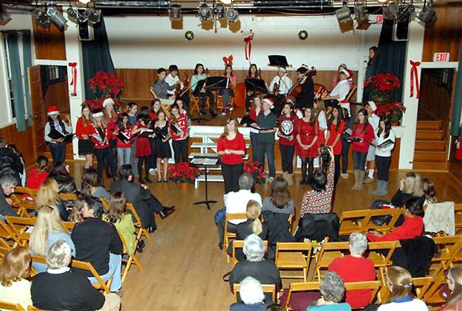 Cooper Middle School students sing Christmas Carols at the concert held at the historic Great Falls Grange on Dec. 12.