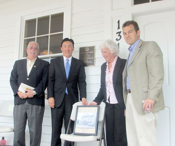 U.S. Congressman Gerry Connolly, Delegate to Virginia Assembly Mark Keam of Vienna, Vienna Mayor M. Jane Seeman and State Senator Chap Petersen celebrate the Freeman Store’s designation as a Virginia historic landmark at the April 21, 2012, plaque unveiling.