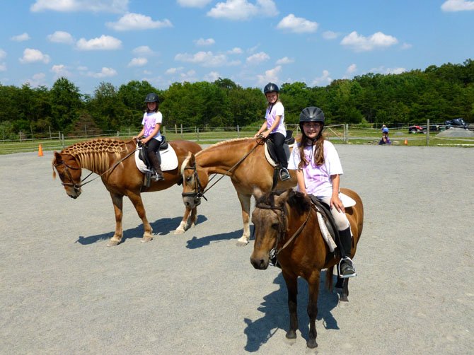 On horseback are (from left) riders Sophia Edwards, Penelope Edwards and Katie Puckett.