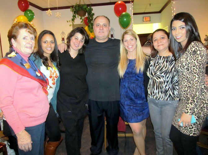 Former and current employees celebrate Milano’s 33rd anniversary and owner Jimmy Goranitis’ 55th birthday during a surprise party Saturday, Jan. 5. (From left) are Judy Kirk, Larissa Cookson, Kayse Krilis, Jimmy, Kalia Sokos, Alina Paulakos and Sahar Williams. Krilis and Kirk organized the party. 
