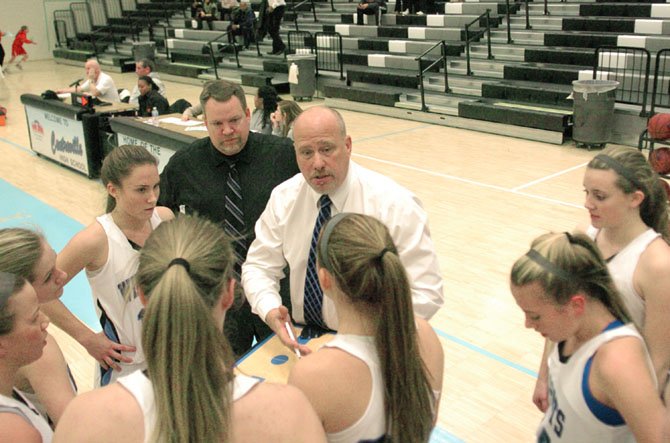 First-year Centreville head girls’ basketball coach Tom Watson speaks to the Wildcats during a game against Herndon on Jan. 7.