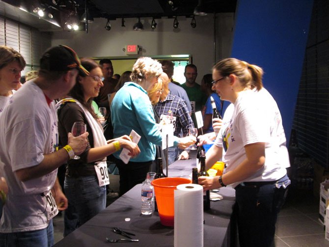 At the wine station sponsored by King Street Blues, participants were offered samples of five different wines, including selections from Kim Crawford (pinot grigio and chardonnay), Drylands Estate, Nobilio and Thorn Clark "Terre Barossa." Wine pourers watched carefully to ensure that sample tickets were deposited into yellow plastic buckets before serving up samples of wine.