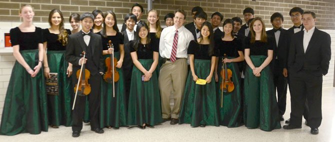 Langley HS District Orchestra students with Dr. Scott McCormick, Langley HS Orchestra Director. From left, first row: Kevin Tan, Lauren Kim, Julia Hara, Dr. Scott McCormick, Rebecca Oh, Ashley Zhang, Madeline Thompson; second row - Penelope Mort-Ranta, Nirosha Beekhuysen, Alexandra Cramer, Claire Lee, Alan Chiang, Brandon Tran, Grace Keffer, Gene Kim, (hidden), Alex Lim, Alex Quion, Harrison Nam, Zach Chou, Cliff Yang (hidden), Jonathan Grow, Alex Blankenship.
