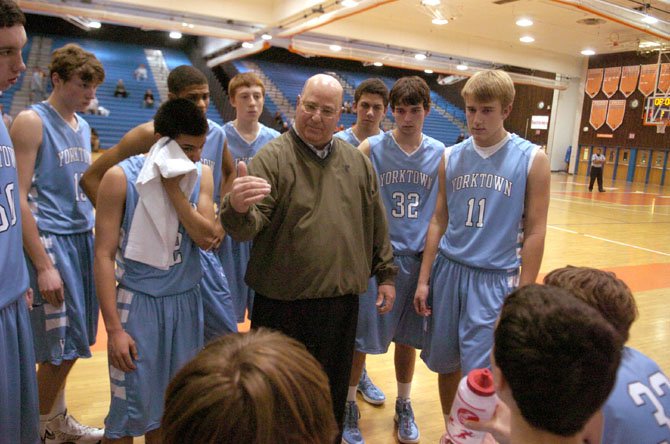 Yorktown boys’ basketball coach Rich Avila speaks to the Patriots during a Jan. 14 game against Hayfield.