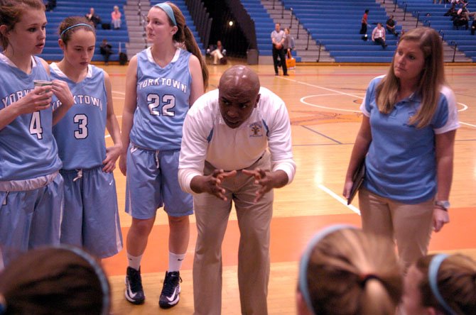 Yorktown head girls’ basketball coach Devaughn Drayton talks to the Patriots during a Jan. 14 game at Hayfield.