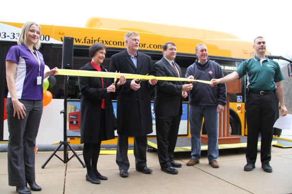 Cutting the ribbon on the new Express Connector Service, from left, Christin Wegener, planning operations manager, Fairfax Connector, County Board Chair Sharon Bulova, Supervisors John Cook (R- Braddock) and Pat Herrity (R- Springfield), VRE CEO Doug Allen, FCDOT Director Tom Biesadny.
