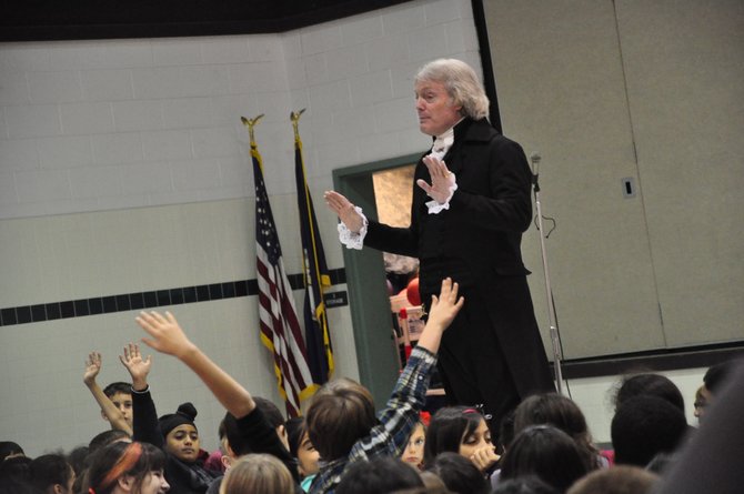 Bill Barker, who plays Thomas Jefferson at Colonial Williamsburg, answers questions from students at Hunters Woods Elementary School Wednesday, Jan. 9, one of six stops he made over two days at local schools. 