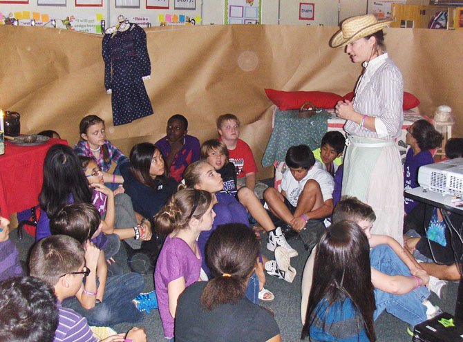 Teacher Maggie Brown addresses Rocky Run seventh-graders as Nebraska homesteader Prairie Annie.