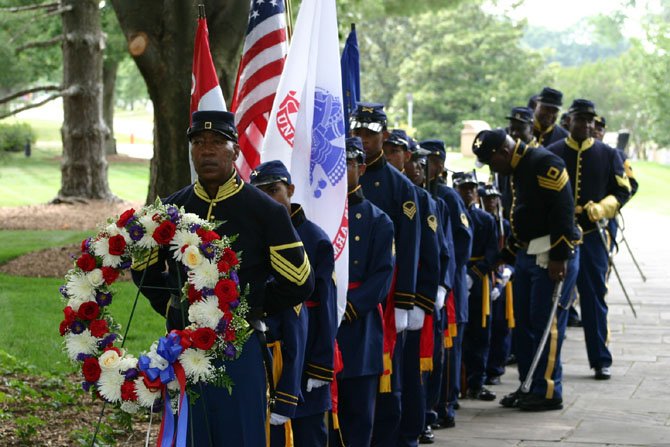 The Rough Riders Buffalo Soldiers and the Junior Buffalo
Soldiers Drill Team lay a wreath at the Tomb of the Unknown Soldiers
at Arlington National Cemetery.