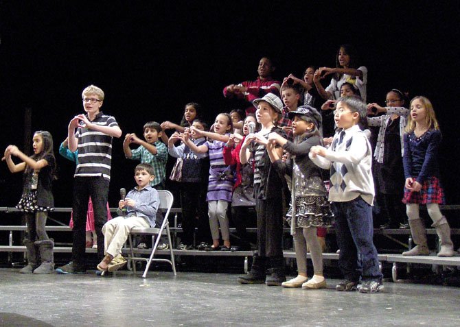 The Colin Powell Elementary Puma Choir sings “Something for
Me, Something for You” during the 2012 festival.