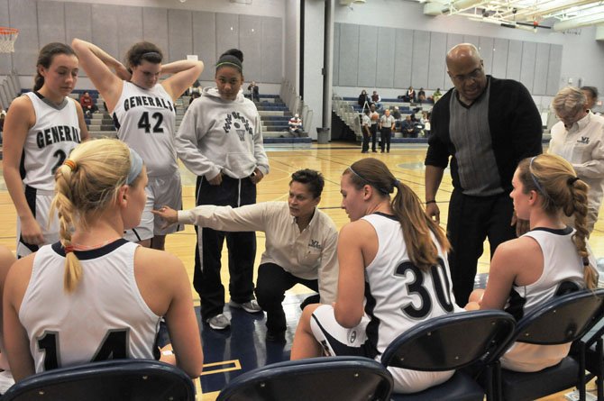 Washington-Lee head girls’ basketball coach Angie Kelly talks to the Generals during a Jan. 17 game against Mount Vernon.