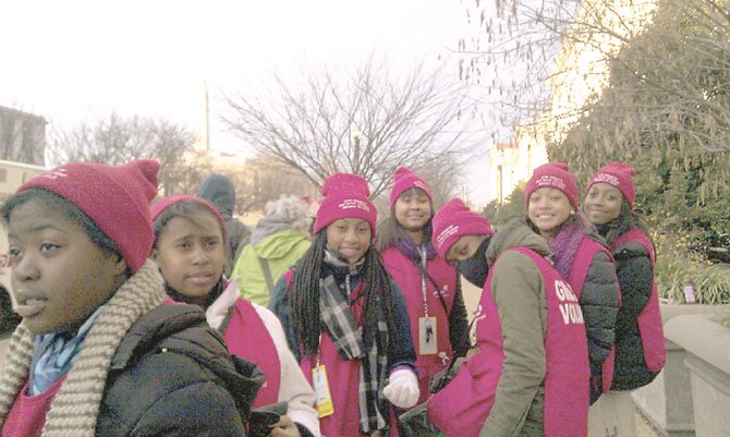 Alexandria resident Genea Luck, a Girl Scout leader, attended the inauguration with Girl Scouts from Troop 4087 at Mount Zion Baptist Church in Arlington. Pictured with Luck are Sydney Whitherspoon, Brianna Smalls, Mikayla Venson, Ashley Christopher, Kimana Bowen, Sharel Jones and Kiersten Criddle. 