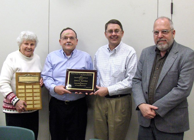 Jim Katcham (second from left) receives the James D. McDonnell Award from (from left) WFCCA Land-Use Committee member Judy Heisinger, Sully District Supervisor Michael Frey and Planning Commissioner Jim Hart.