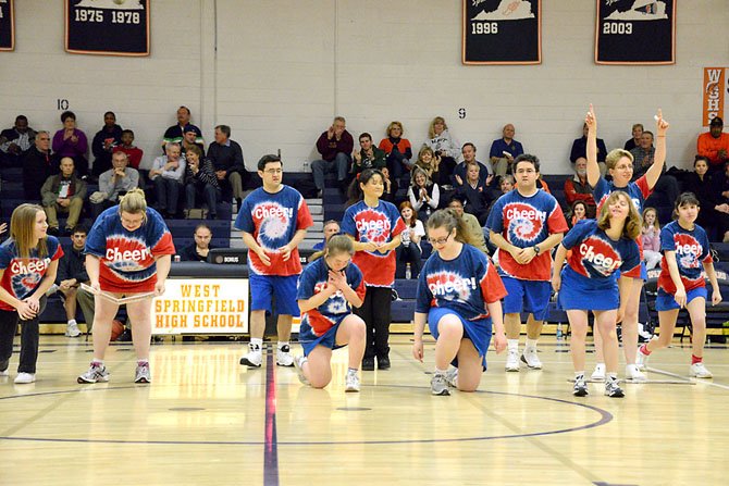 The Northern Virginia Special Olympics cheerleading team performed for the first time on Friday, Jan. 11, during halftime of the girls' basketball game at WSHS. The crowd cheered and clapped along with the team. (Front row, from left) Jill Arnott, Ginger Fischer and Jacquelyn Hoffmeier; Back Row: Heather Savage, David Vonack, assistant coach Keiko Vonack, Brian Vonack and Samantha Cully.
