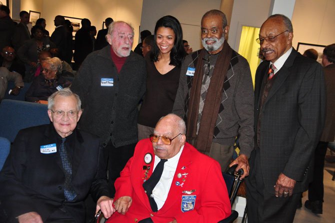 From left, Dudley Johnson, Reston founder Robert Simon, Jennifer Johnson, Hiram Mann, a member of the Tuskeegee Airmen, Tom Wilkins and Chuck Smith at the Martin Luther King Jr. Cultural Foundation’s celebration at Herndon’s ArtSpace Saturday, Jan. 26. 