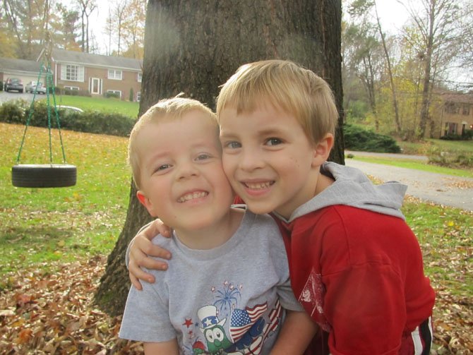 Pictured with his brother, 4-year-old John Gluck, diagnosed with a rare and severe form of muscular dystrophy, is rooting for doctors at the National Health Institute and throughout the world to find the cure to his degenerative muscular disease. Eat at Santinis Restaurant, 11804 Baron Cameron Ave., Reston, from 5-9 p.m. on Thursday, Feb. 7, and 15 percent of the bill supports Cure CMD. 