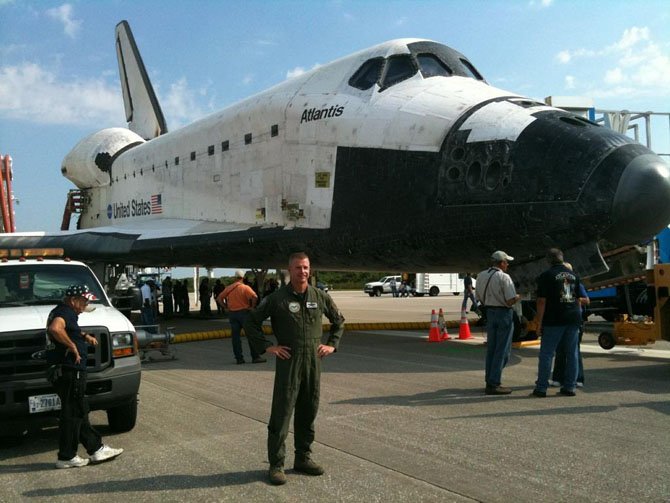 Alexandria resident Col. Nathan “Chili” Lindsay is shown July 21, 2011 in front of the Space Shuttle Atlantis at NASA's Kennedy Space Center in Florida. The Atlantis mission STS-135 brought to an end the 30-year space shuttle program.
