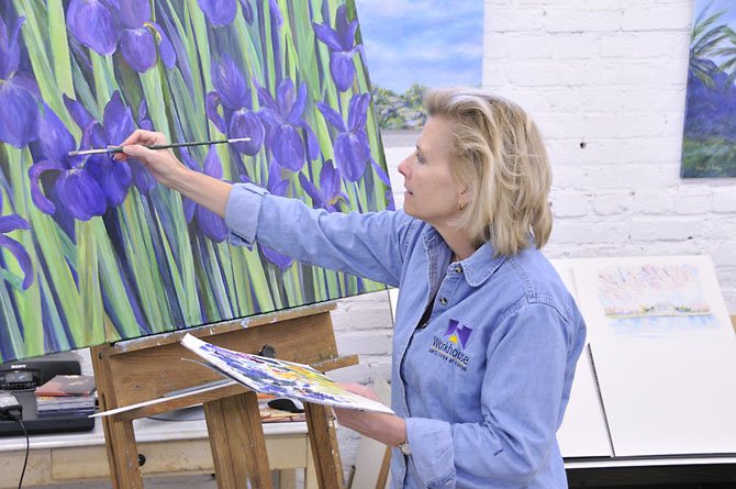 Workhouse Arts Center artist-in-residence Karen Ching works in her studio. 