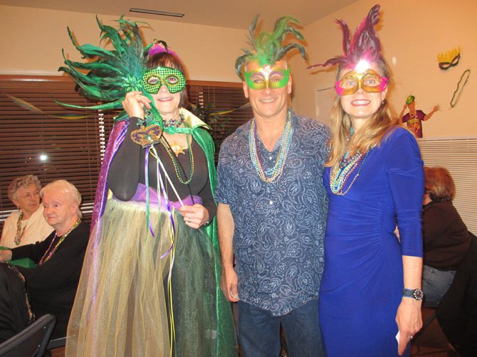 Mardi Gras “Queen” Margaret Dellinger with guests Steve and Desiree Sedgwick of Vienna, at Dan Dellinger’s fundraiser on February 2.