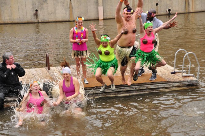 Divers hit the 35-degree water at Lake Anne Saturday, Feb. 2, to raise funds for Camp Sunshine, a camp for families of children suffering from life threatening illnesses. 