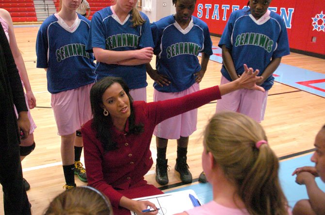 South Lakes girls’ basketball coach Christy Winters-Scott has the Seahawks atop the Liberty District standings.