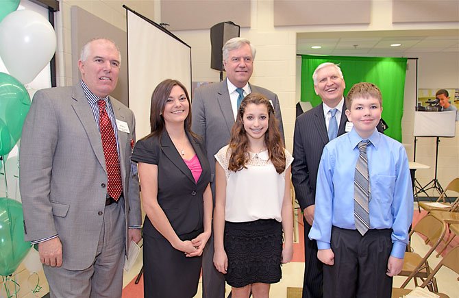 Jim Kacur, assistant superintendent cluster 2, Fairfax County Public Schools, Superintendent Dr. Jack Dale, and Deputy Superintendent Dr. Richard Moniuszko were among the attendees at the Learning Lab dedication. The three school district officials take a moment to congratulate Wolftrap ES Principal Teresa Khuluki and sixth grade students Leah DeFreitas and Will Hertzler, who both presented original works created for the ceremony.