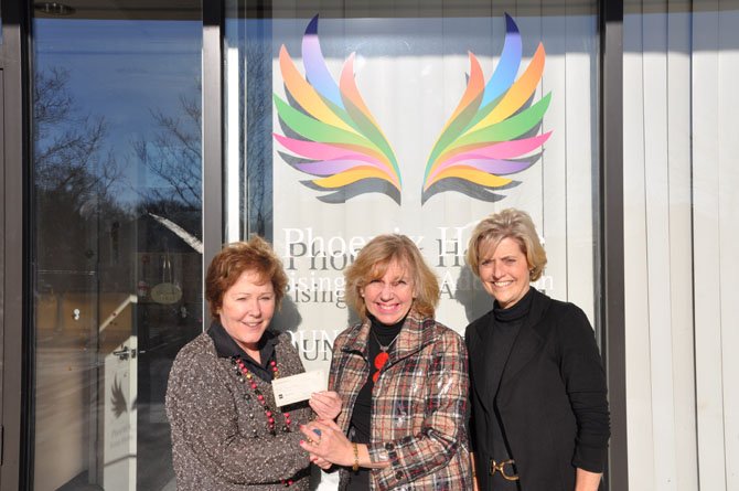 Each Fall The Dominion Guild, Inc. hosts an open house and coffee with boutiques. The proceeds from the annual fundraiser are distributed to qualifying projects and entities serving the Northern Virginia Community. After this year’s event, the Guild donated $42,500 to five institutions.
Above, a check is given to The Phoenix House. From left are Deborah Taylor, senior VP/regional director; Janice McKelvey, chair of Projects Committee, and Vicki Kirkbride, president of The Dominion Guild.