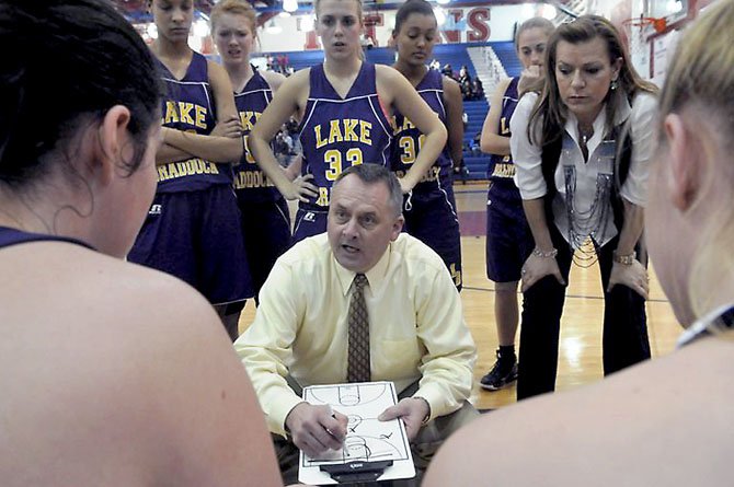 Lake Braddock girls’ basketball coach John Giannelli talks to the Bruins during a Tuesday, Feb. 5, game at T.C. Williams.