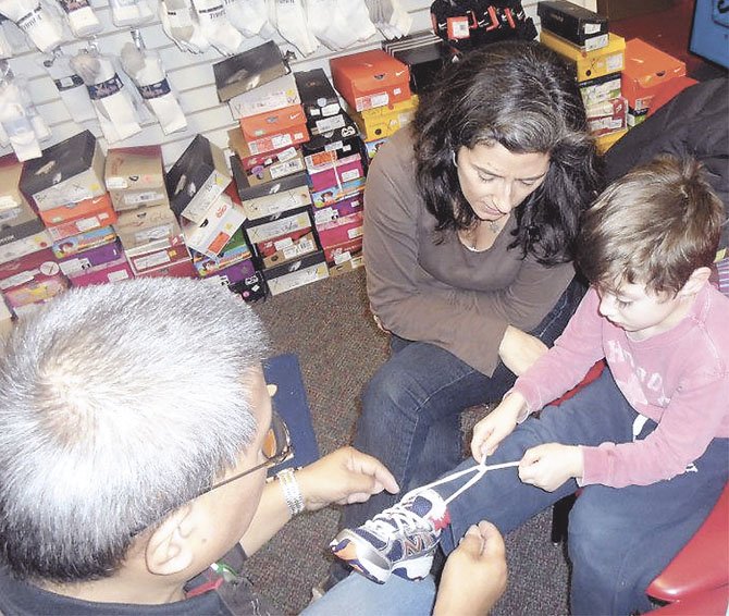 Mary Hanlon’s son Hank Amaditz learned to tie his shoes at a clinic taught by Bill Wong, called “Shoe Tying with Mr. Bill” at the Shoe Train in Cabin John.