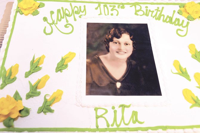 Rita De Lazzari, 103 years old (picture on cake was taken wheb Rita was 18 years old)