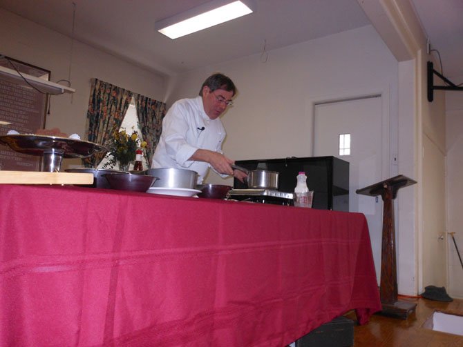 Chef Jacques Haeringer of L’Auberge Chez Francois shows guests at the Great Falls Senior Center February event how to make chocolate truffles. 