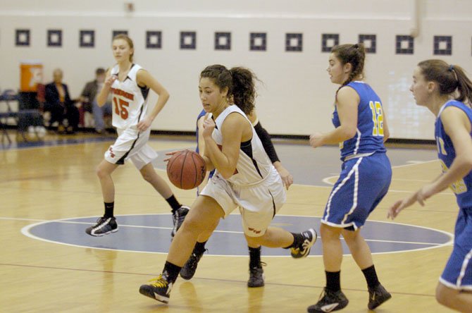 Woodson senior Anna Walker, who played for Falls Church her freshman and sophomore seasons, will make her first trip to the Northern Region tournament after the Cavaliers defeated Lee in the first round of the Patriot District tournament on Feb. 12.