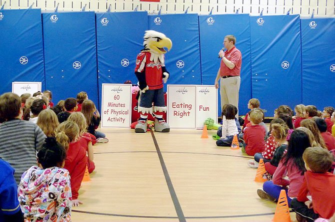 DJ Jarrod and Washington Capitals mascot Slapshot agree that fitness, fun and nutrition are good for Union Mill Elementary School students.