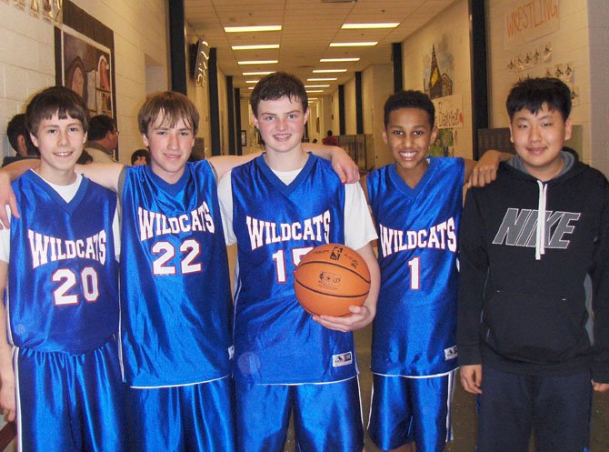 Playing in Saturday’s basketball tournament were SYA Wildcats (from left) Nathan Lee, Trent King, Carter Egbers and Robert Okoro. At far right is their friend Young Lee, and they’re all Liberty Middle eighth-graders.