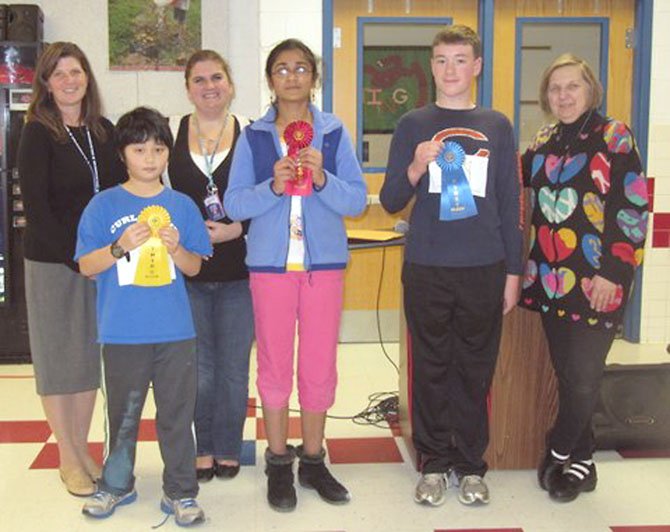 Churchill Road Spelling Bee Winners (from right) Matthew Cox (first), Soumya Peri (second) and Eric Gan (third) show off their ribbons. Also pictured are teacher sponsors Cindy Zemke, Jennifer Williams and Jan Clark.