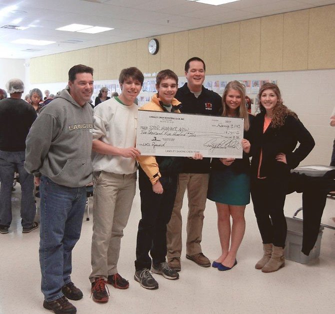 Check donation: From left, Principal Matt Ragone, Crew Captain Liam Fitzmorris, Crew Captain Thomas Marzol, Stop Hunger Now coordinator Dominic Alexander, Crew Captains Ashley Doll and Tyler Seckar.
